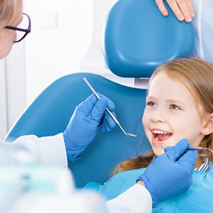 Child smiles at dentist