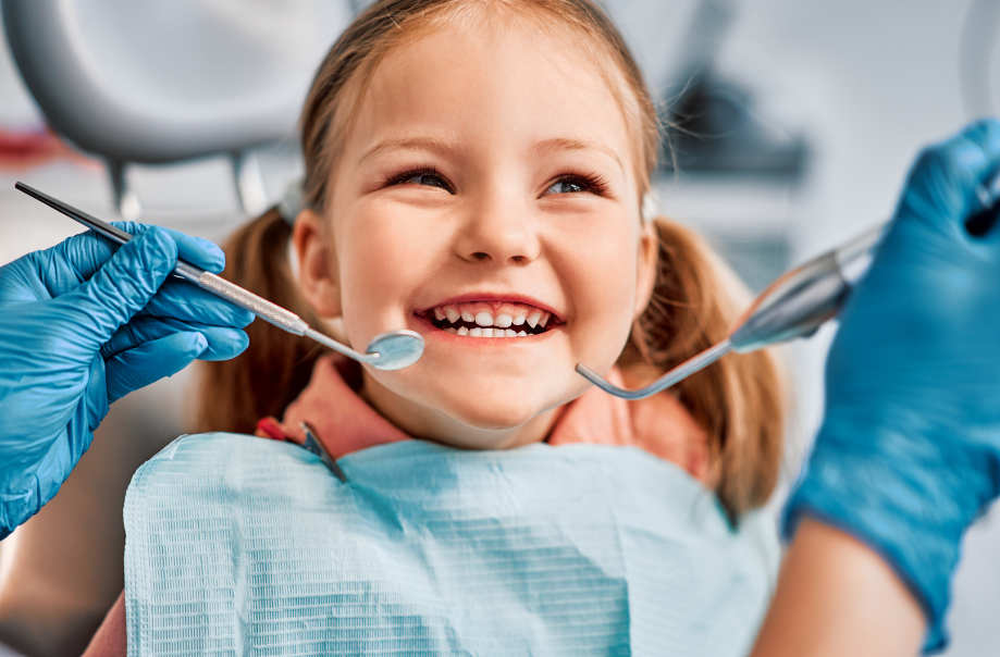 Little girl in dental chair having exam