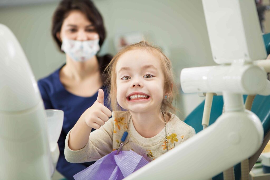 Girl smiling at the dentist